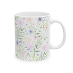 Watercolor floral coffee mug, side view of the pink, purple and peach flowers with green leaves